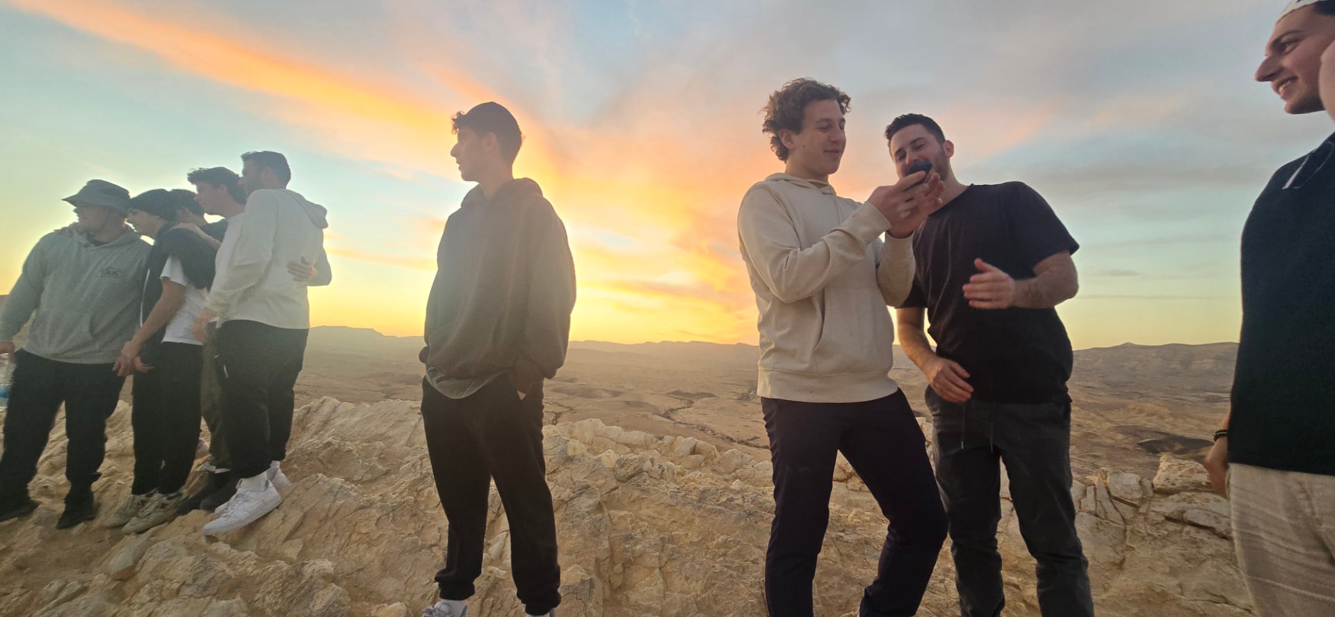 Talmidim at a desert overlook at sunset in the Negev