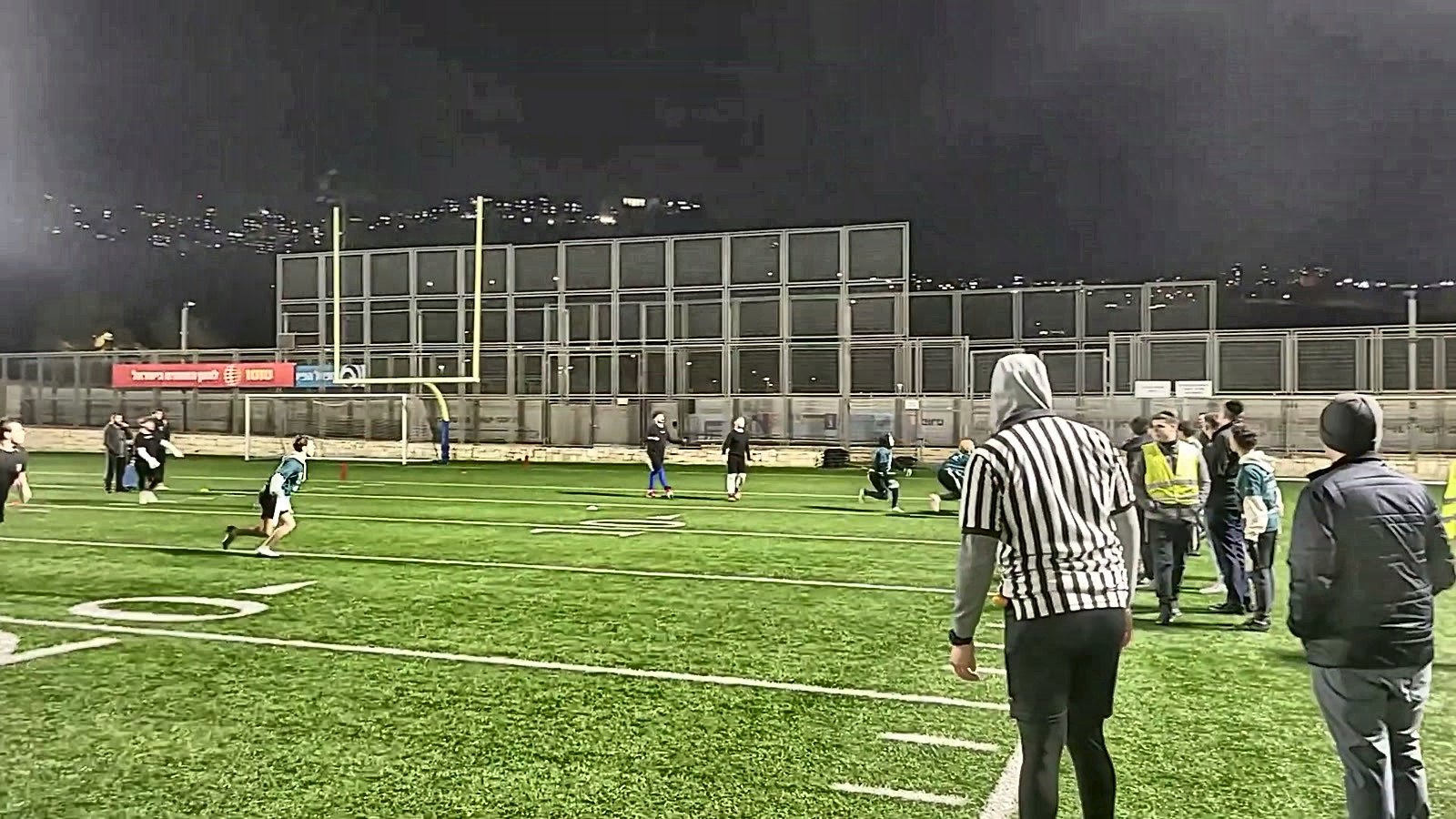An evening game on the floodlit field