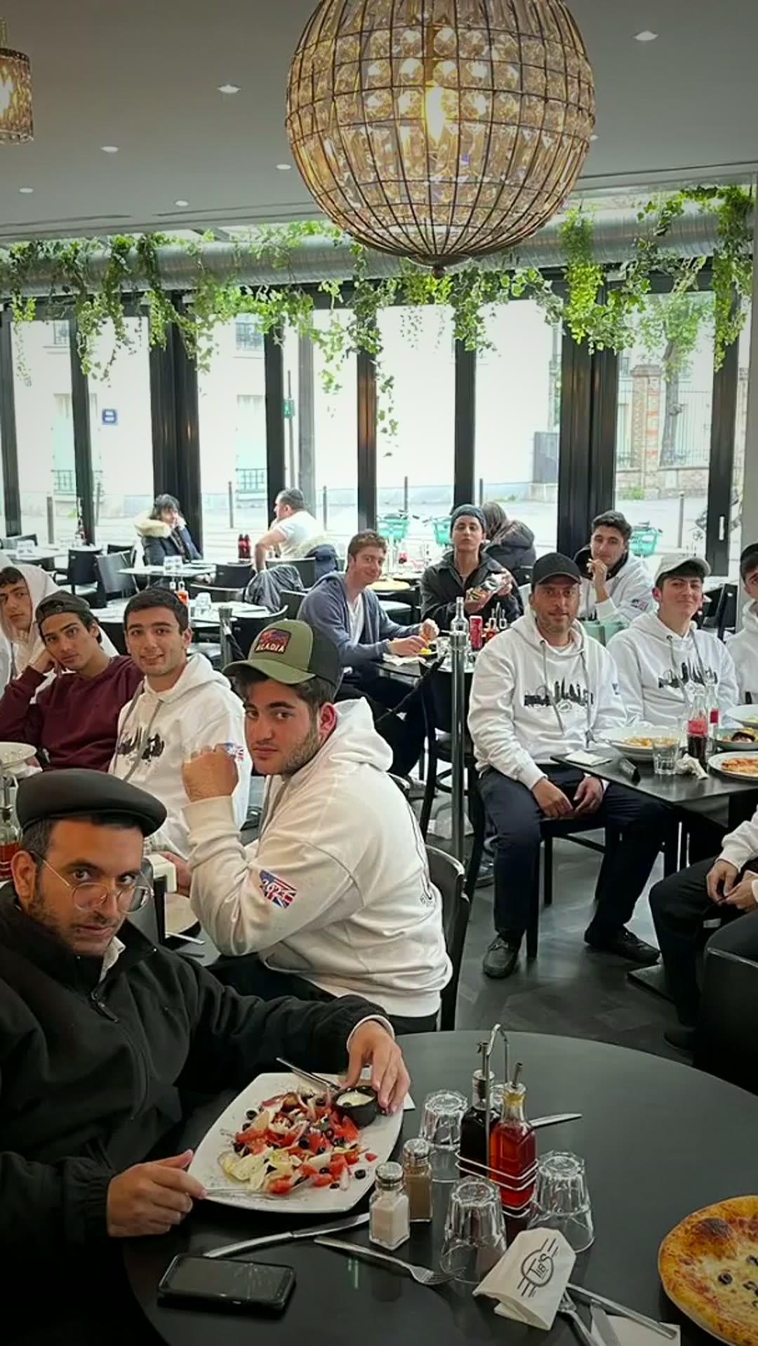 Talmidim sitting down to a meal together on the overseas trip