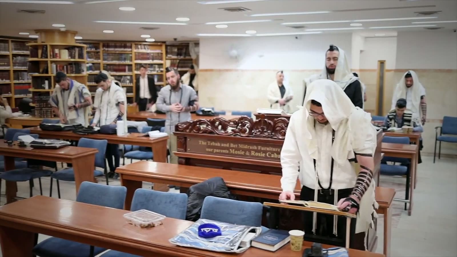 Talmidim in tallit and tefillin during shacharit in the Bet Medrash