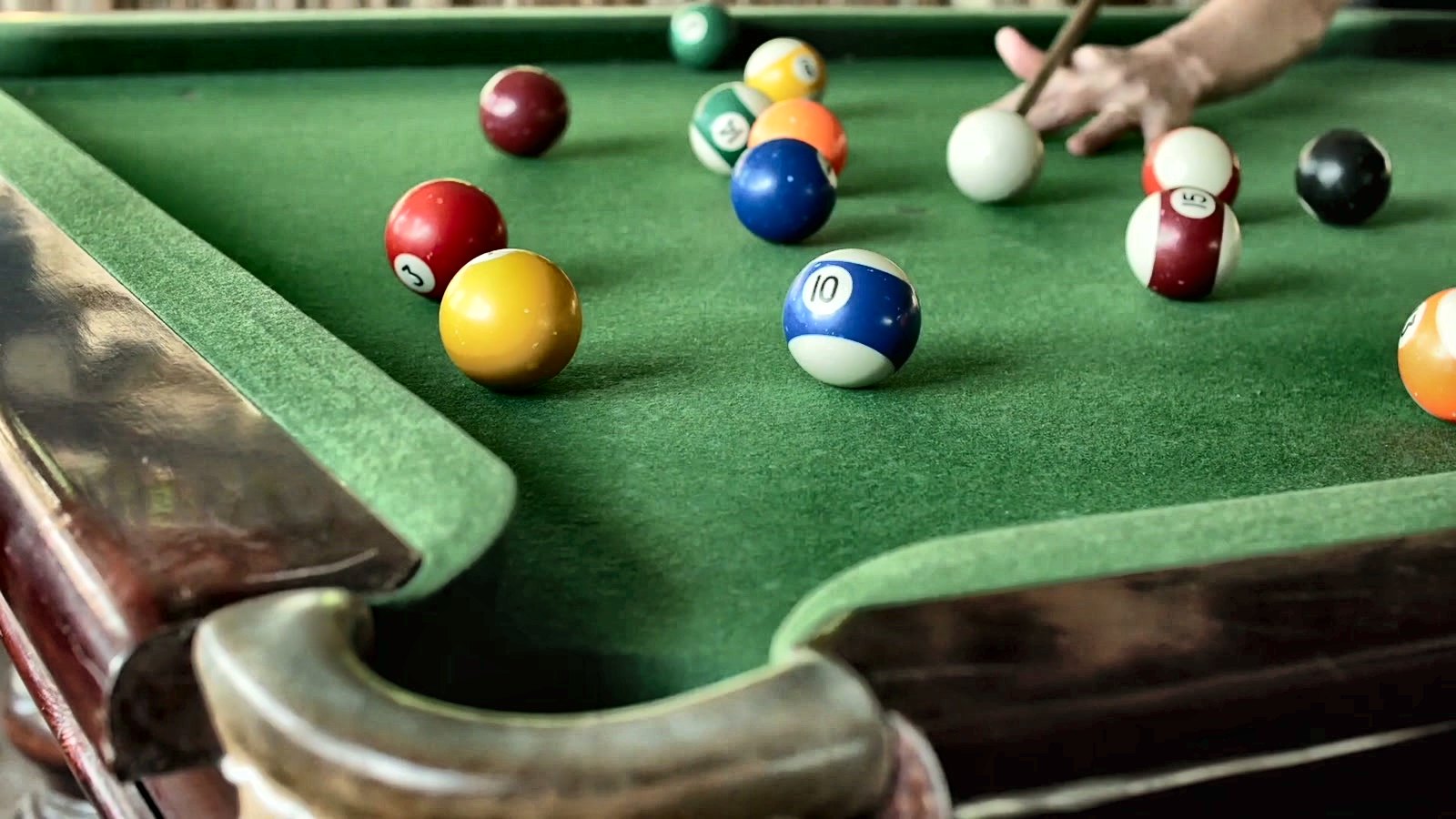 A break shot on the game room pool table