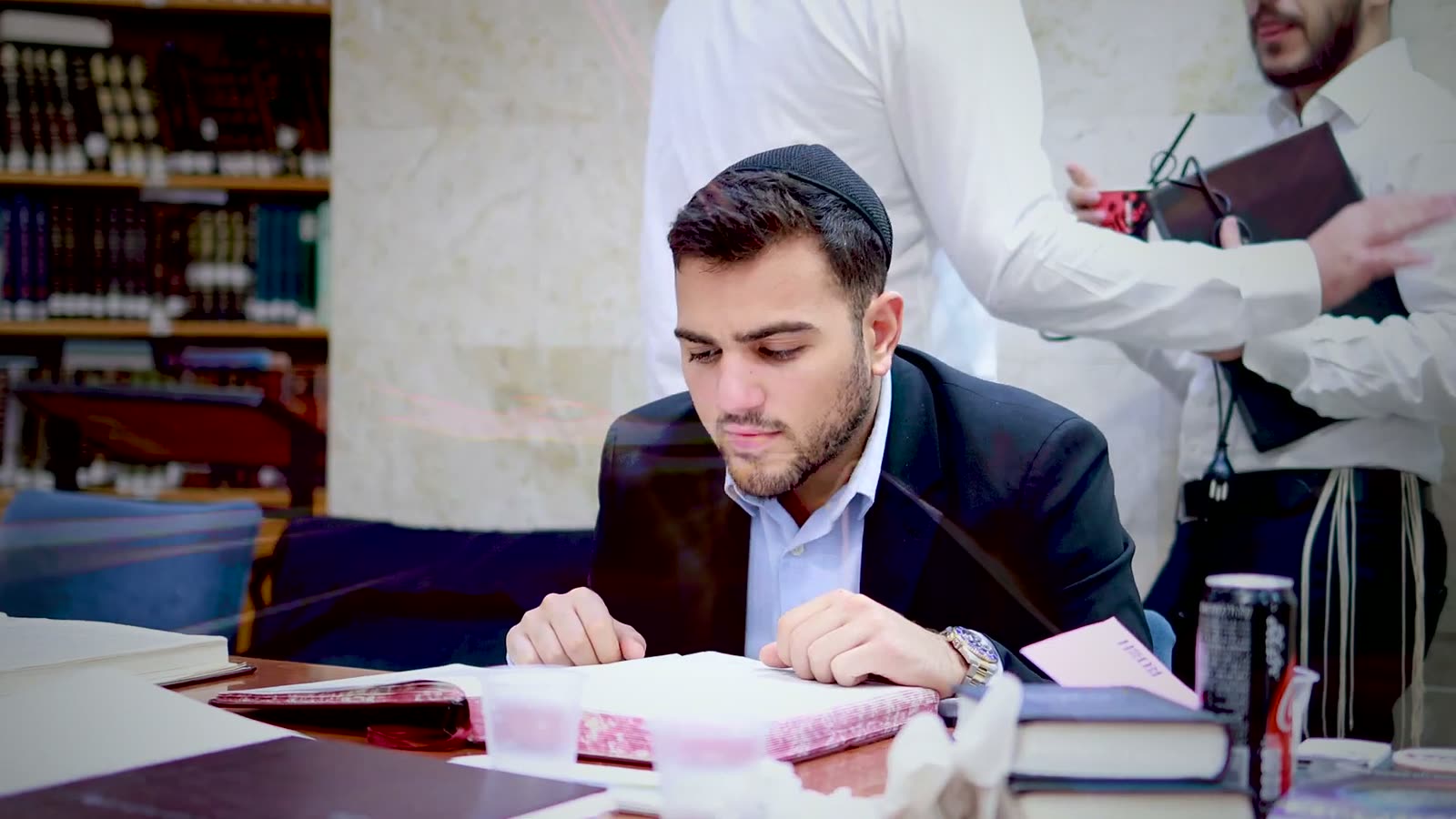 A talmid learning at his place in the Bet Medrash after shacharit