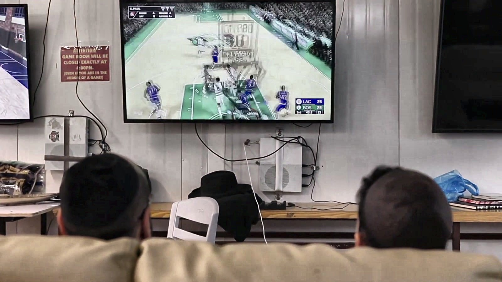 Talmidim watching a game together on screen